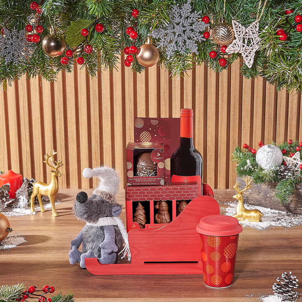Holiday Wine and Hollyberry Chocolate Gift Basket in Red Wooden Sleigh – how the gift is presented